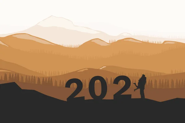 背景がぼやけている山の上に2021年のテキストを持つミニチュアカップルのシルエット — ストック写真