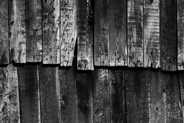 Alte antik bemalte schwarze Holzwand. — Stockfoto