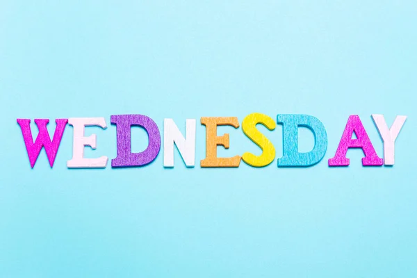 Word Wednesday in multicolored letters on a blue background