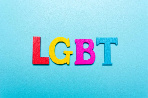 Palabra Lgbt Letras Color Arco Iris Sobre Fondo Azul — Foto de Stock