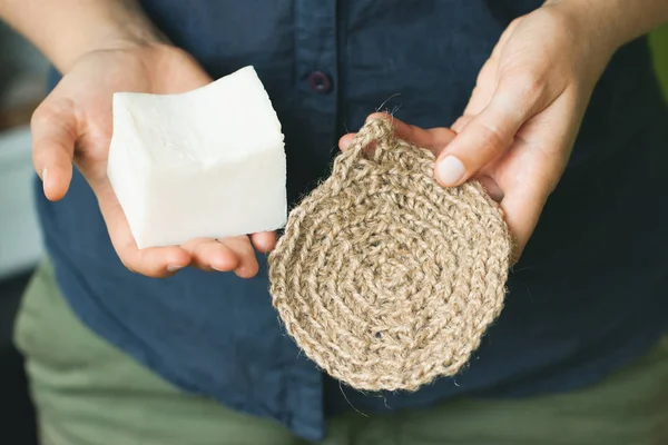 Eco-friendly cleaning kit in the womans hand