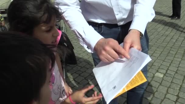 OLOMOUC, CZECH REPUBLIC, APRIL 12, 2018: Public Reading People to Holocaust Victims in the City of Olomouc, A young Jewish man and Gypsy children talk about the Roma Holocaust, very authentic — Stock Video