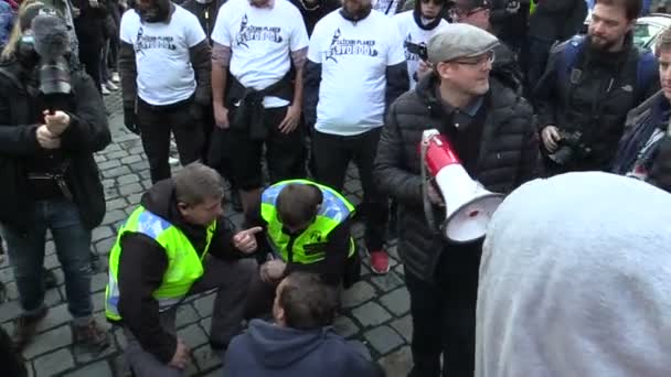 Anti Fascist activists antifa try to block the march, negotiate with the police, crowd and a gathering for a march with a megaphone. Radical extremists racism — Stock Video