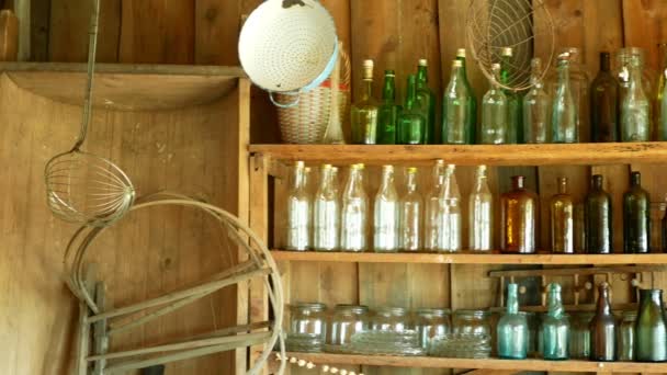 Jar bottles with glass and carboy, traditional Moravia cottage old folk Hana. Interior of peasant and dishes glassful hut, farmhouse, house articles furniture crockery or tumblerful punch things — Stock Video