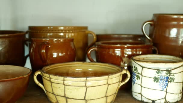 Traditional Moravia cottage old folk Hana with pots jar and bottle with burnt clay crockery and dried herbs. Interior of peasant and dishes, house articles furniture things, farmhouse dwelling — Stock Video