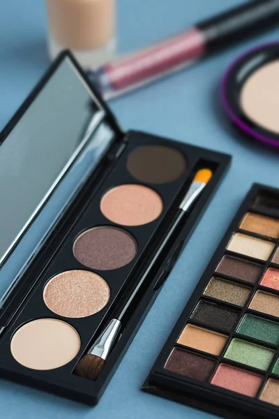 Set of decorative cosmetics, makeup tools on grey background — Stock Photo, Image