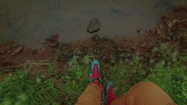 Walking on grass and moss in trekking boots — Stock Video