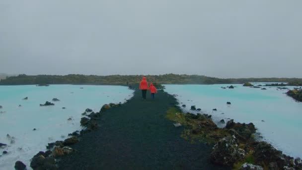 Family, kid walk during holiday trip in iceland — Stock Video