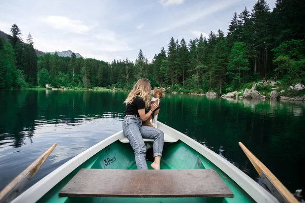 Hipster travel woman with best friend pet on boat — Stock Photo, Image