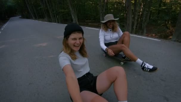 Two female friends make video selfie on action camera, laugh and smile out loud, make fun and jokes, silly faces, having great time on outdoor active extreme sports lifestyle — Stock Footage Two Female Friends Make Video Selfie Action Camera Laugh Smile Royalty Free Stock Footage