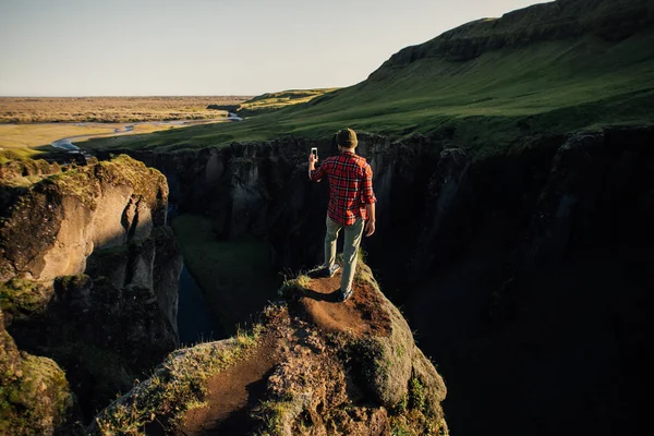 cool millennial hipster traveler in mountain trip