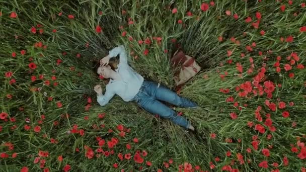 Young feminine blogger woman in flower field — Stock Video