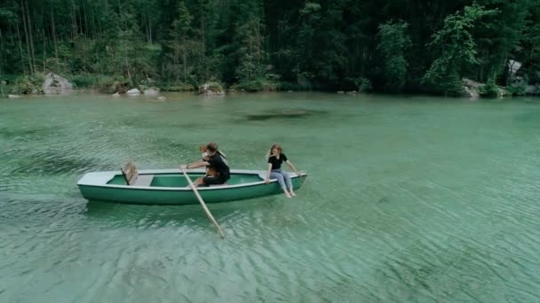 Happy millennial couple on boat in alpine lake — Stock Video