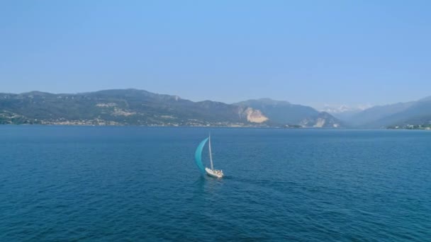 Cinematic sail boat on mountain lake or ocean — Stock Video