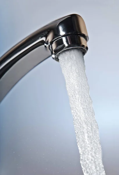 Water flows from a tap — Stock Photo, Image