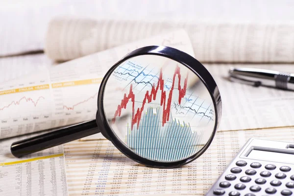 Magnifier with stock prices — Stock Photo, Image