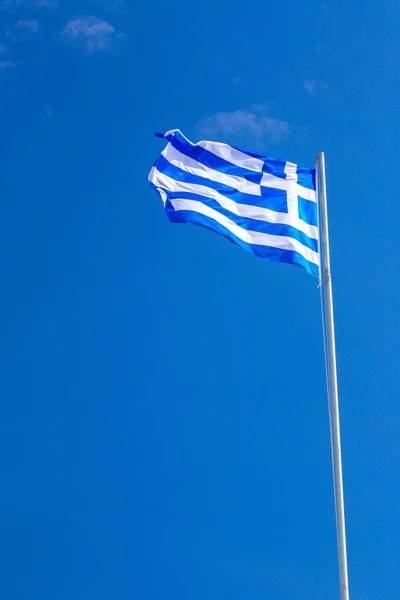 National flag of Greece on the flagpole on deep blue sky backgro — Stock Photo, Image