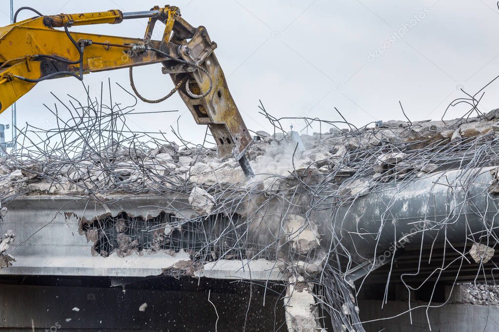 Professional demolition of reinforced concrete structures using 