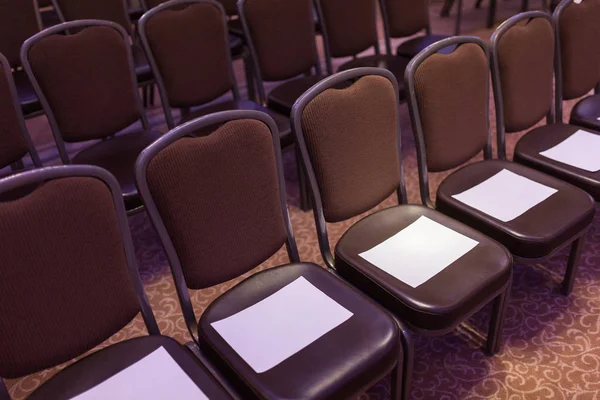 Brown chairs the conference hall before the event. First row for