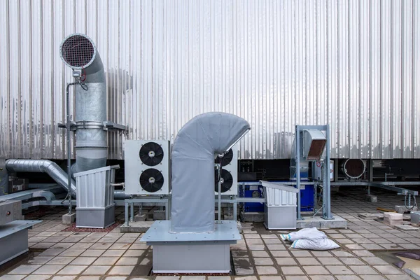 External infrastructure of the microclimate support system at a large industrial site. Air pipelines inlet and exhaust. Fans and air conditioning. Systems of control of pressure, humidity, temperature