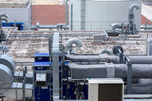 External infrastructure of the microclimate support system at a large industrial site. Air pipelines inlet and exhaust. Fans and air conditioning. Systems of control of pressure, humidity, temperature