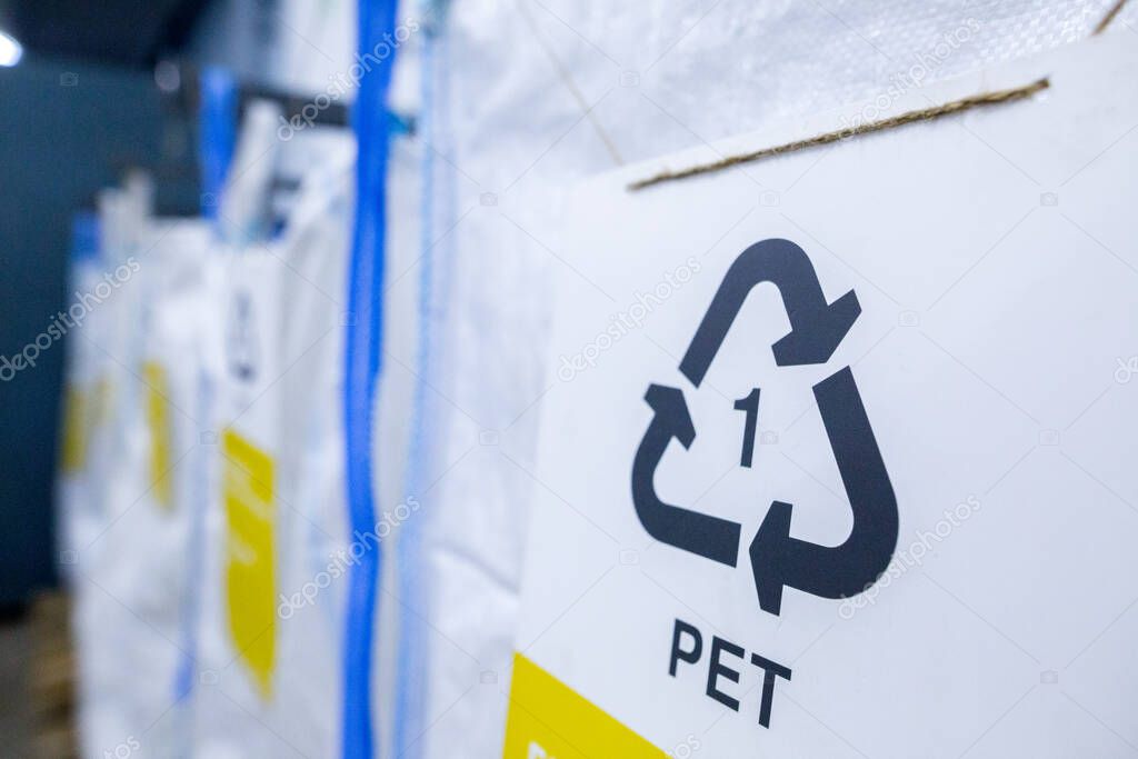 Sorting recyclables. The sorted polyethylene terephthalate (PET) plastic, is placed in a container with the appropriate marking.