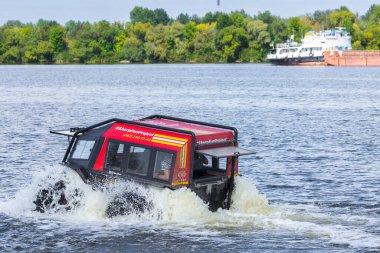 Sherp is a Ukrainian all-terrain amphibious vehicles for rough and soggy terrain. As part of the fun project Sherp carries passengers on the Dnipro River in Kyiv, Ukraine, on August 28, 2019. clipart
