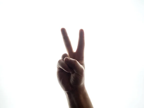 Чоловіча рука на білому фоні жест перемоги — стокове фото