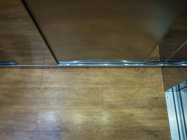 Laminate brown wood in the elevator at Rosa Khutor — Stock Photo, Image