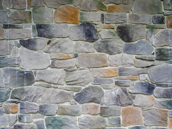 Texture of beautiful stones on the wall on the street — Stock Photo, Image