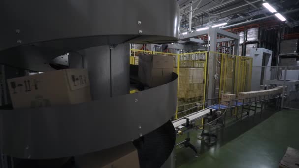 Belarus, Minsk - January 25, 2018: Warehouse, cardboard box is moving along the production line. — Stock Video