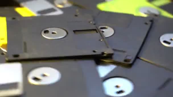 Pile of old style data transfer floppy discs, rotating spinning background — Stock Video