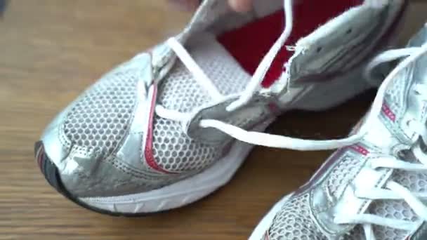 Male hands lace up shoes time lapse — Stock Video