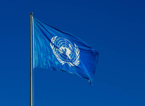 Rome, ITALY, JANUARY 21, 2018 - United Nations flag fluttering in the wind, with blue sky