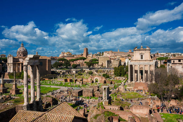 Rome, ITALY, APRIL 1, 2018 - Sightseeing in Rome. Tourists visit Roman Forum ancient ruins