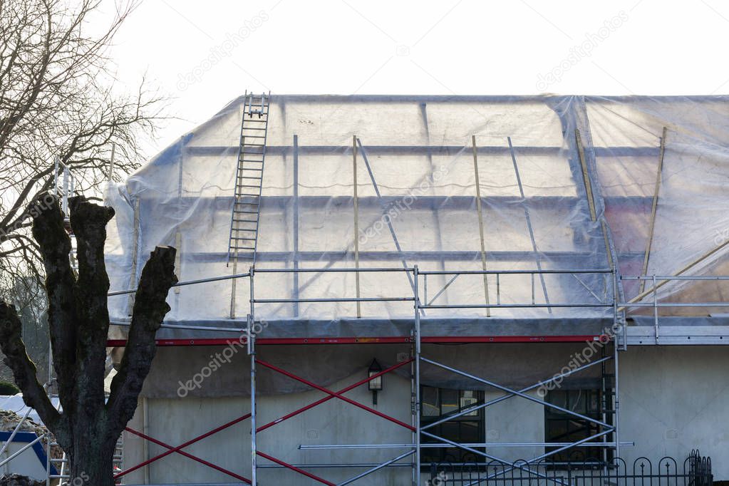 Roof covered with plastic sheeting because of a complete roof renovation in the Netherlands