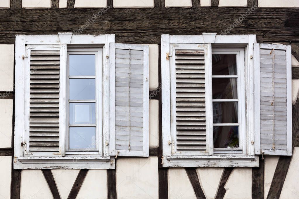 Vintage windows with white shutters