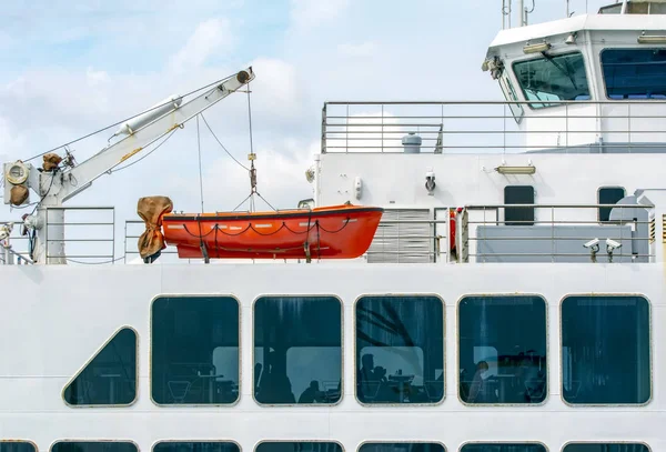 View of modern safety lifeboat carried by a cruise ship for use in emergency evacuation