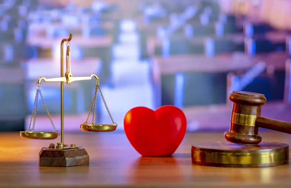 Justice Gavel and stethoscope with red heart on background.law concept Judge law medical Pharmacy compliance Health care business rules.