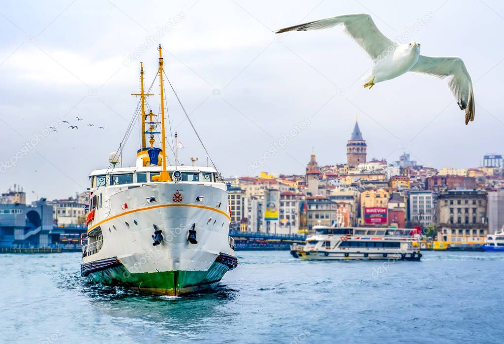 Muslim architecture and water transport in Turkey - Beautiful View touristic landmarks from sea voyage on Bosphorus. Cityscape of Istanbul at sunset - old mosque and turkish steamboats, view on Golden Horn.