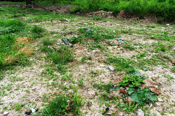 Plastic debris is lying on the ground.