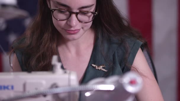 Young Woman Sewing American Flag Tilting She Feeds Her Sewing — Stockvideo