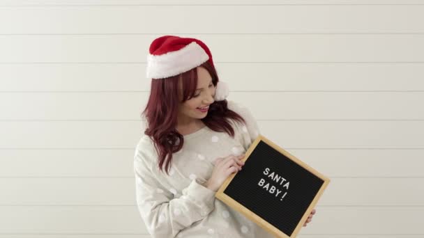 Woman Holding Blackboard Words Santa Baby — 비디오