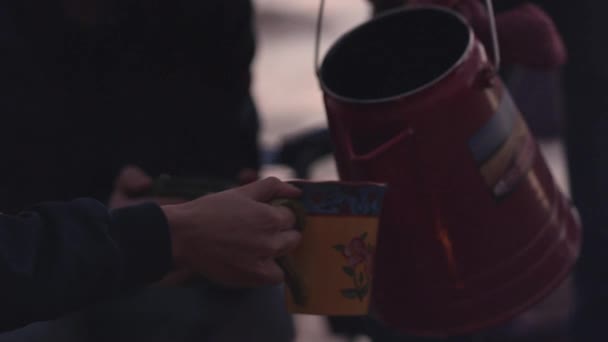 Man Pouring Tea Kettle Cup Woman Outdoor — Stock Video