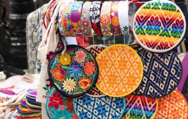 Mexican crafts, multicolored tortilleros with Mexican ornaments.