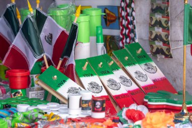 A table with flags and other items, including a sign that says 