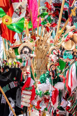 A display of Mexican items including a shirt with the letters 