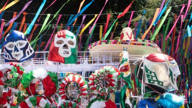 A display of Mexican masks and hats. Scene is festive and colorful. Decoration to celebrate Independence Day in Mexico, zocalo