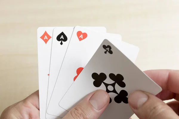 Close up of playing card hand of four aces