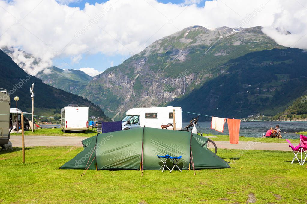 Motorhomes at campsite by the Geirangerfjord in Norway. Concept pictures
